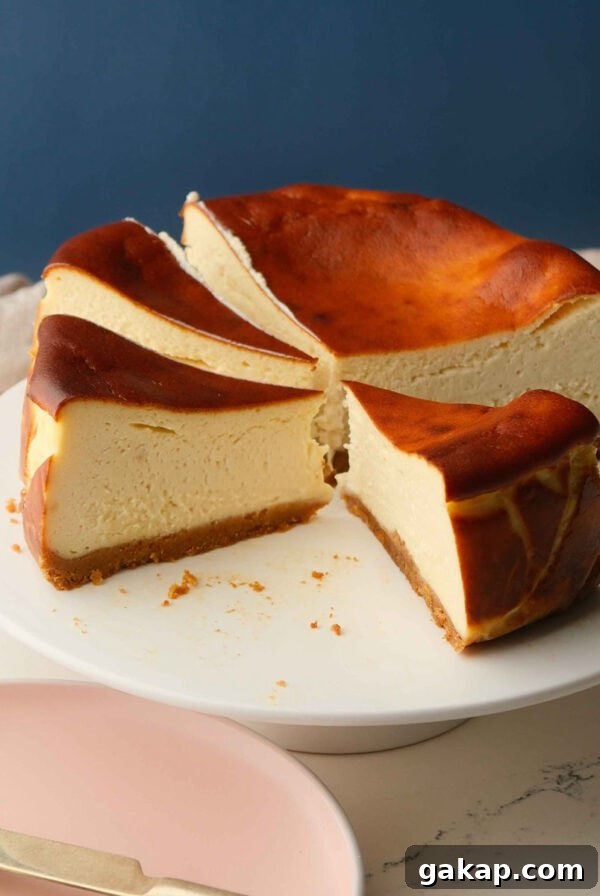 whole san sebastian cheesecake on a white cake stand.