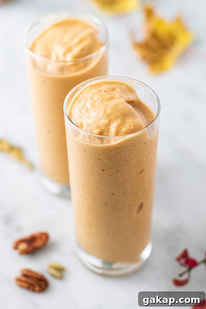 Pumpkin Spice Latte Smoothie Recipe — Fall Coffee Smoothie 5 Two thick pumpkin spice latte smoothies in clear glasses.