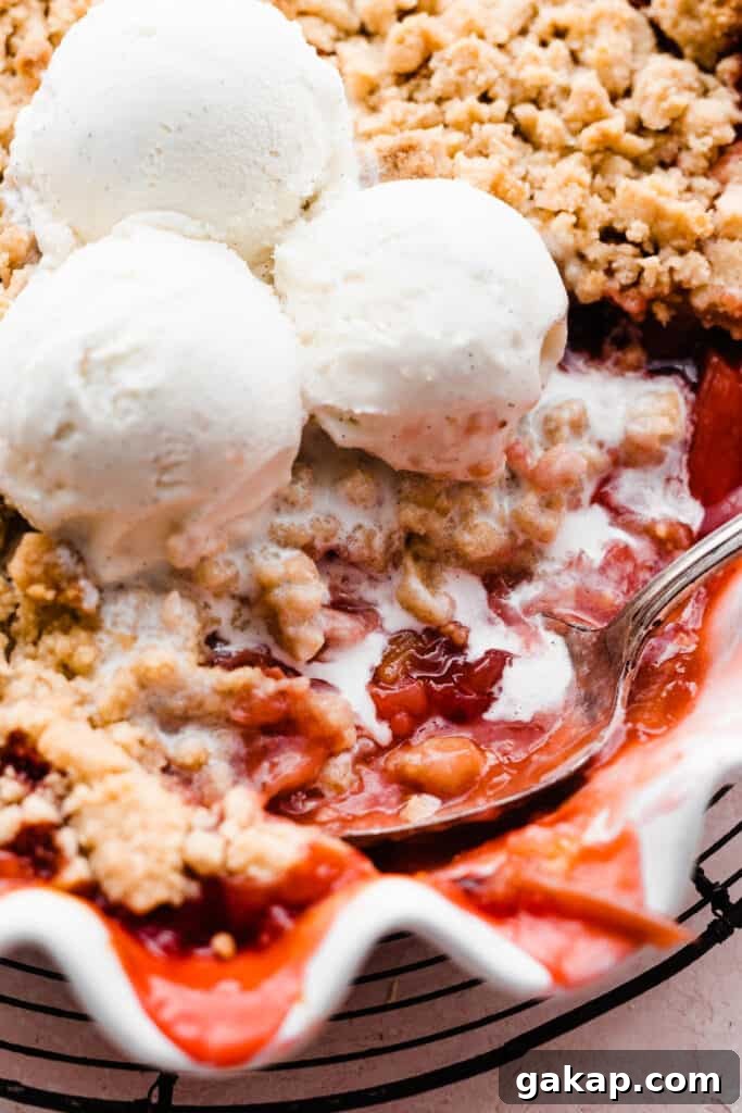 A close-up of a serving spoon digging into the dessert.