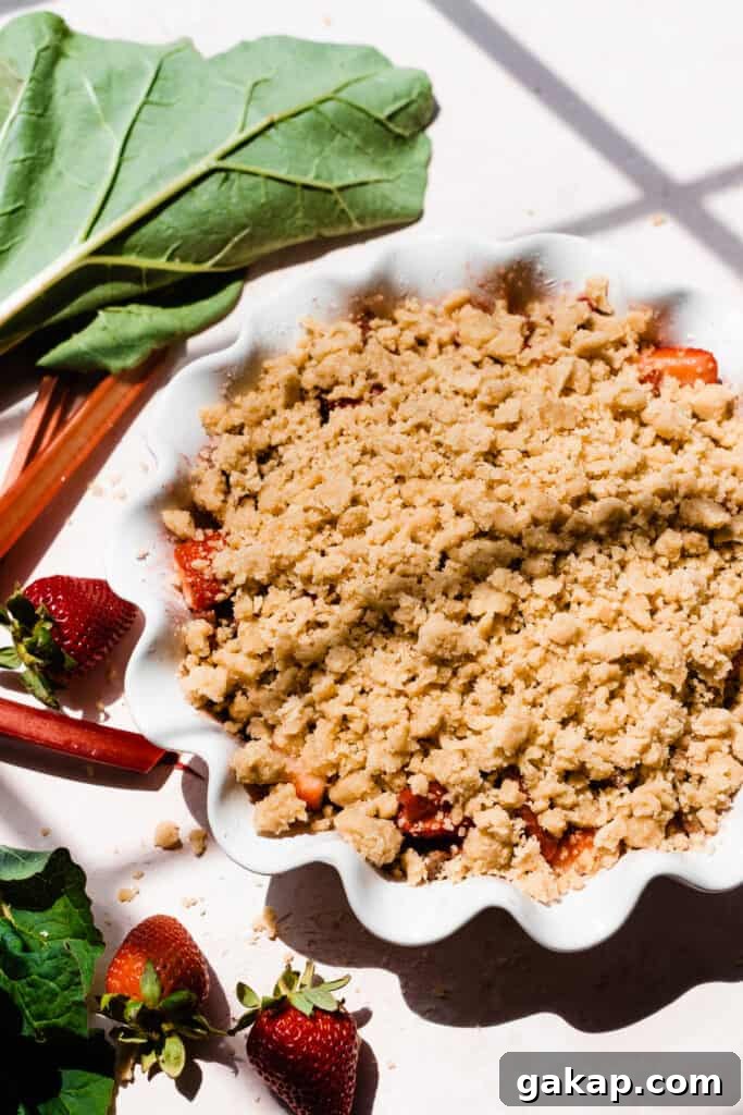 The crumble topping over the fruit filling, before being baked.