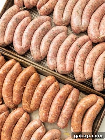 Homemade sausage on baking trays.