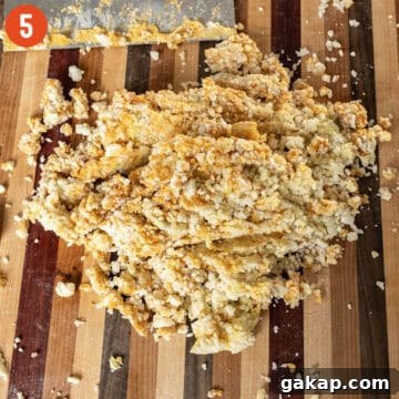 Homemade Pumpkin Gnocchi Recipe with Sage Butter 7 Cutting flour, pumpkin puree, salt, egg yolk, and potato together.