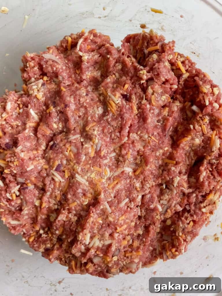 mixed meatloaf in a bowl, ready to shape into loaves