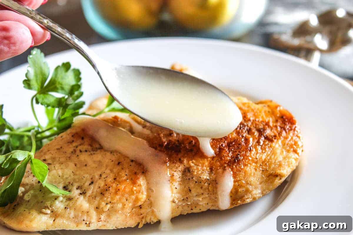 Quick Lemon Butter Sauce in 5 Minutes for Fish & Pasta 5 Lemon Sauce being drizzled over chicken breast