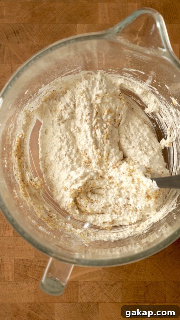gently fold the walnuts into the egg whites