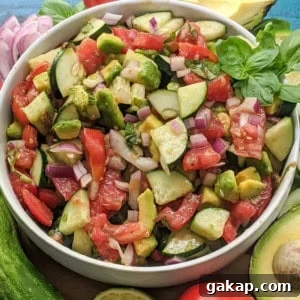 Delicious side salad packed with fresh cucumbers, tomatoes, avocado, basil, and more! Paleo, Whole30, and Vegan friendly as well as dairy-free, gluten-free, and sugar-free. Easy, satisfying, and only 8 ingredients.