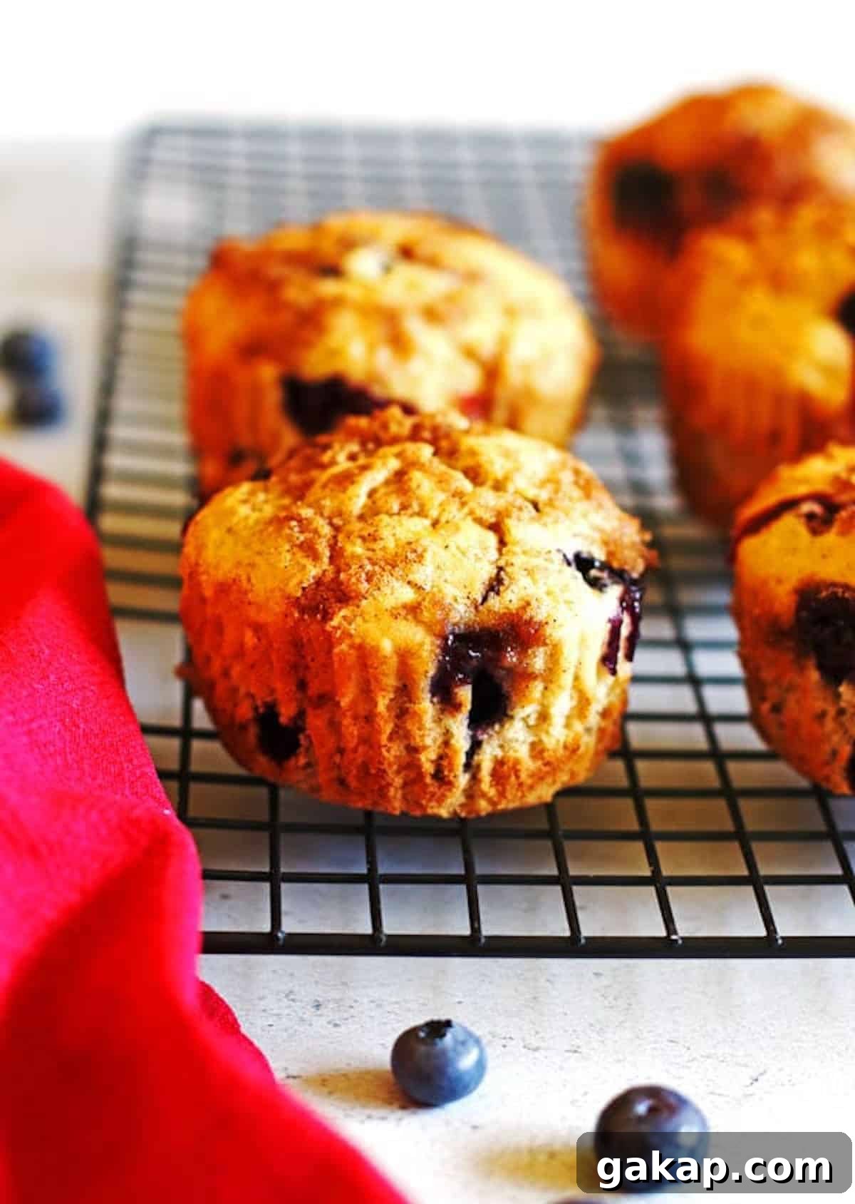 Blueberry Banana Muffins on a black cooling rack