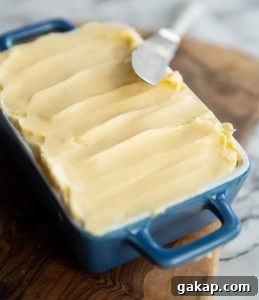 butter in a small blue dish with knife resting on it