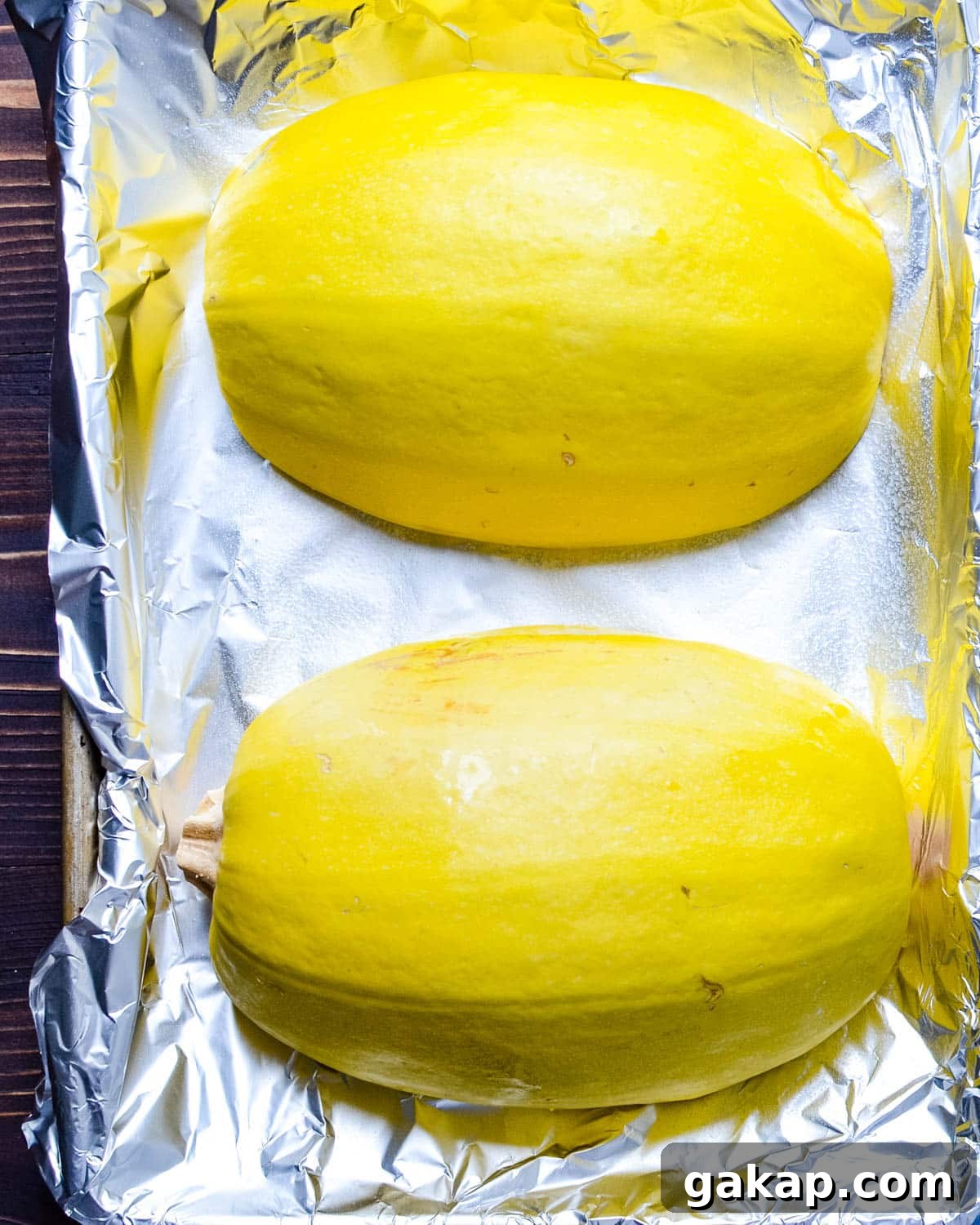 Roasting spaghetti squash, cut side down on a baking sheet.