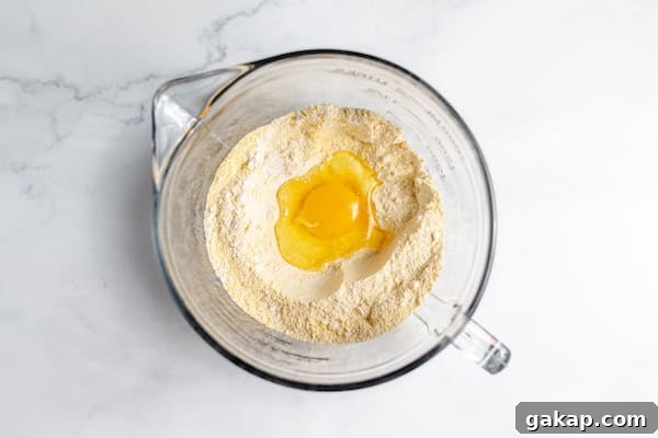 egg dropped in the center of dry ingredients