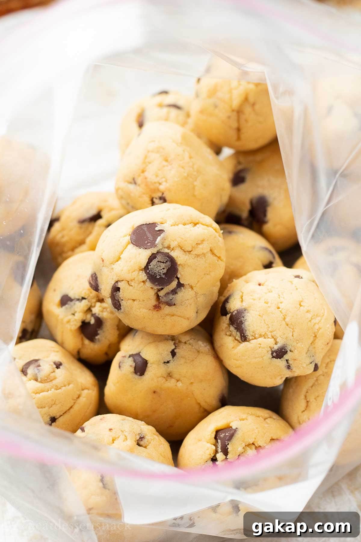Raw cookie dough balls in freezer bag.