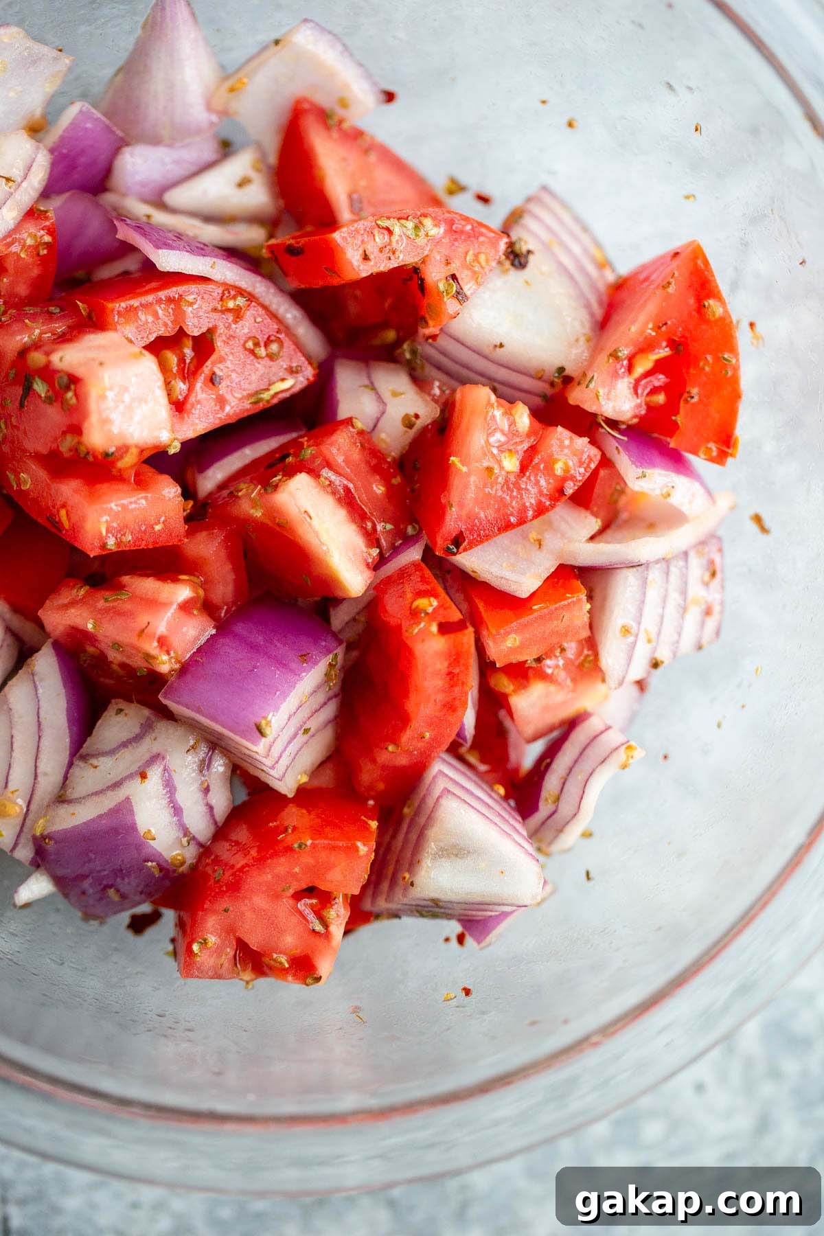 Tomatoes and onions mixed together with spices.
