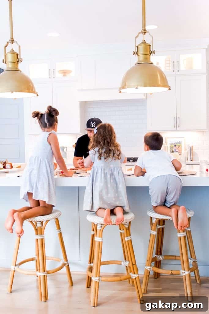 3 kids on counter stools