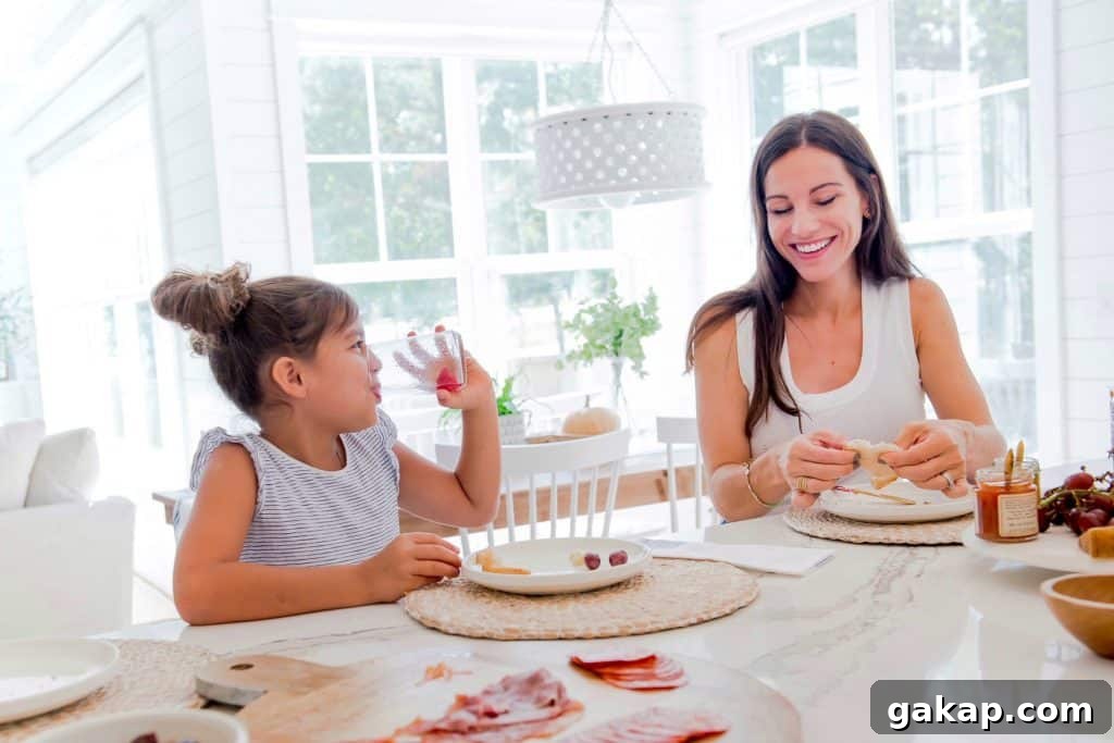 mom and daughter eating happily