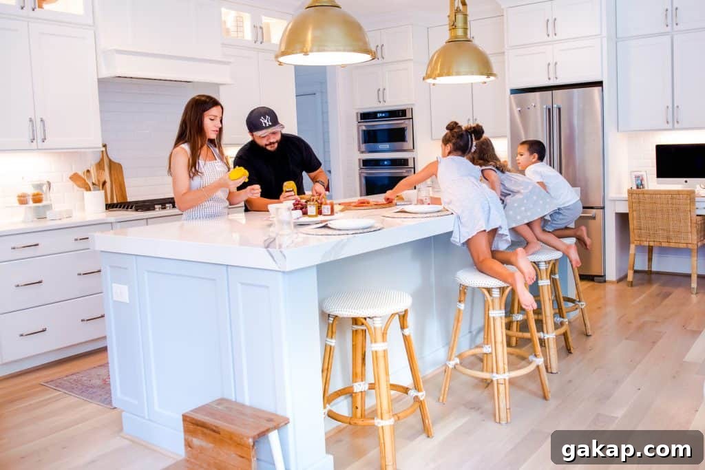 family cooking together at kitchen, 3 kids sitting on kid friendly counter stools