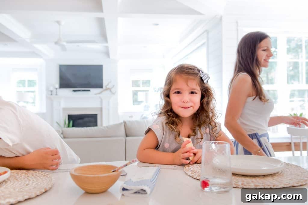 little girl smiling in the kitchen