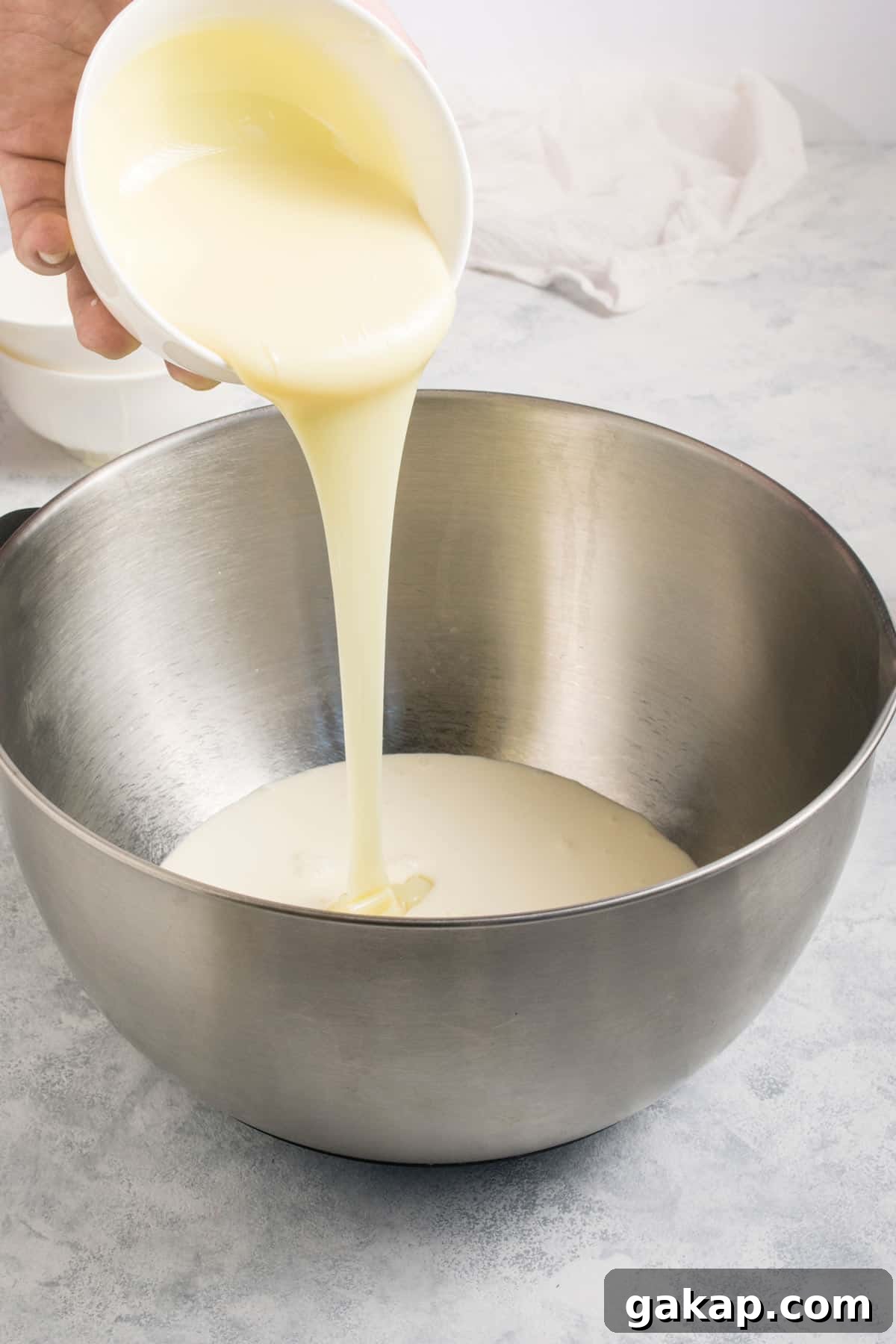 No-Churn Margarita Ice Cream: Creamy Lime & Tequila Recipe 4 Adding all ingredients for margarita ice cream in a large bowl.