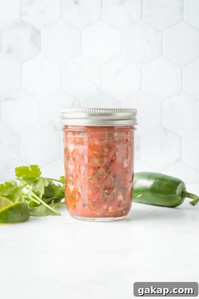 Jar of blender salsa with the lid on.