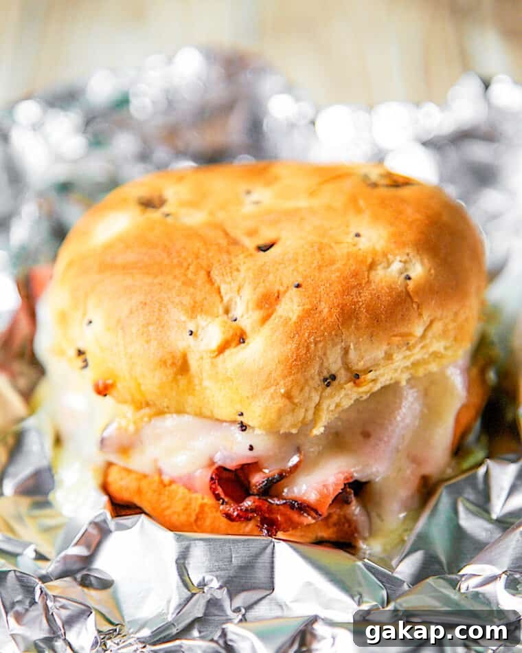 Melted Ham and Cheese Sandwiches: Quick Oven & Skillet Recipes 3 baked ham & cheese sandwich in aluminum foil