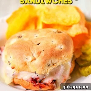 Melted Ham and Cheese Sandwiches: Quick Oven & Skillet Recipes 4 baked ham & cheese sandwich on a plate with chips