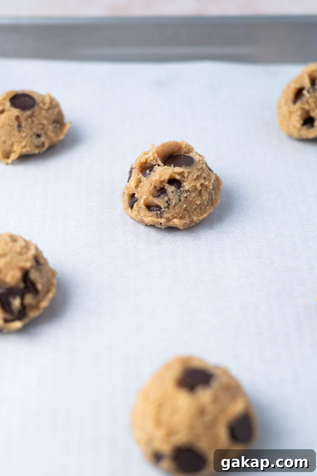 Crispy Thin Chocolate Chip Cookies: Crunchy, Perfectly Baked 9 chocolate chip cookie dough on a parchment lined baking sheet