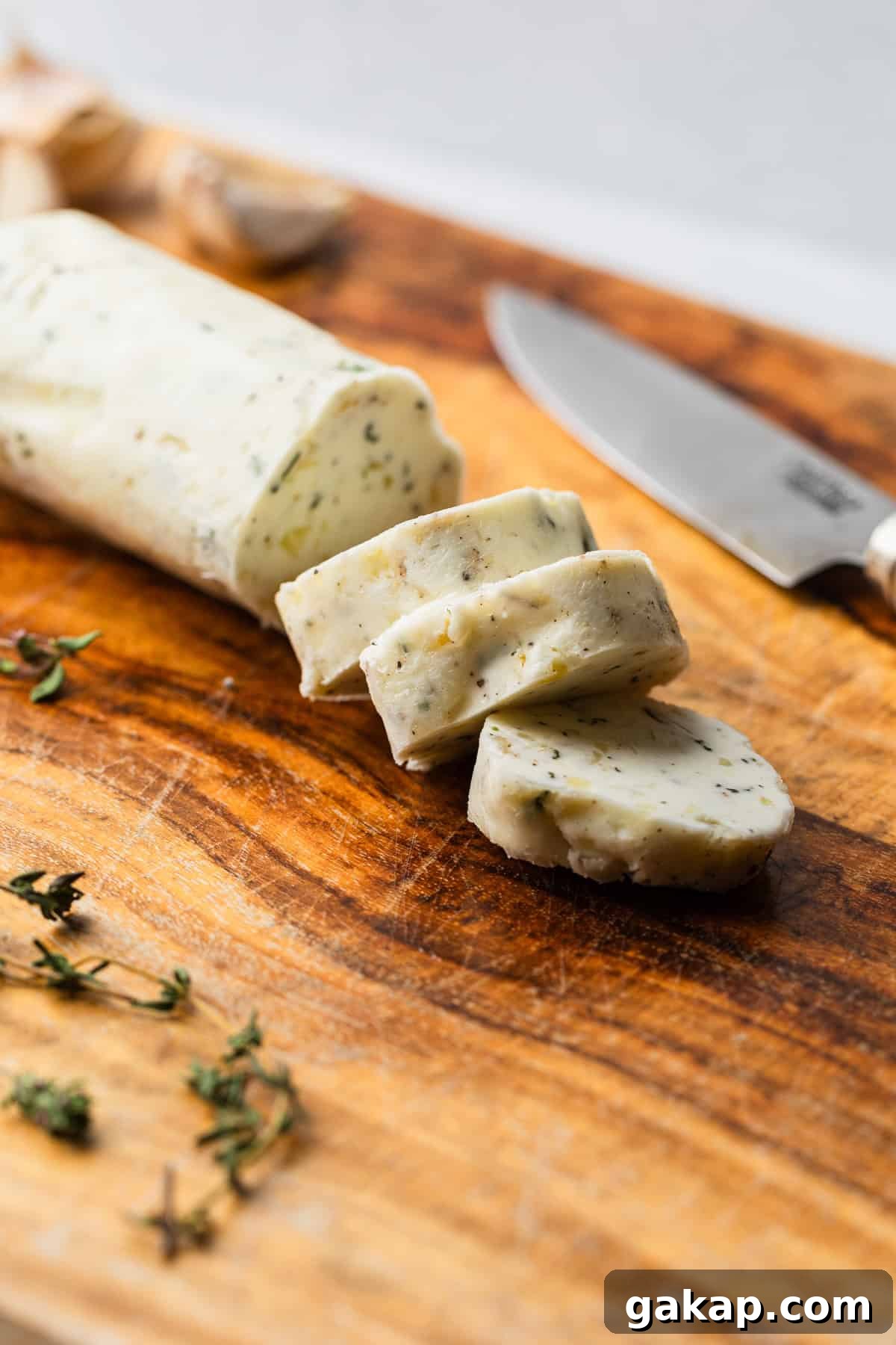 The compound butter sliced on a cutting board.