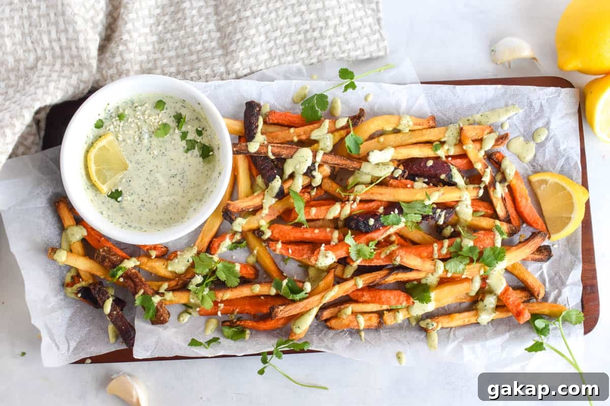sweet potato fries with tahini sauce drizzled over top. 