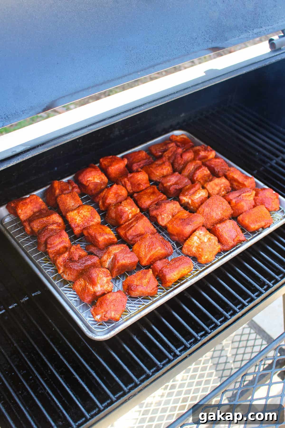 Honey Garlic Pork Belly Burnt Ends Recipe for Sticky, Crispy Bites 2 Honey Garlic Pork Belly Burnt Ends getting placed on the smoker.