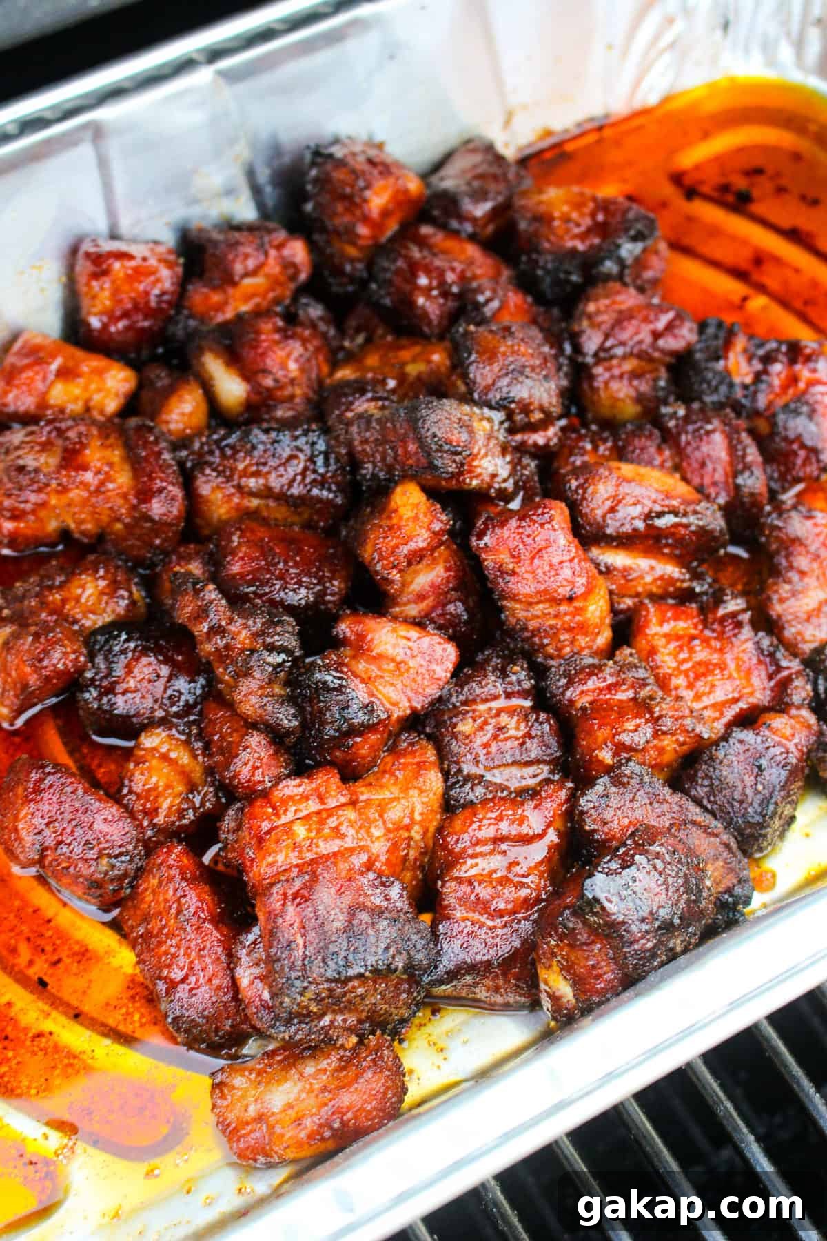 Honey Garlic Pork Belly Burnt Ends Recipe for Sticky, Crispy Bites 6 Honey Garlic Pork Belly Burnt Ends about to be pulled from the smoker.