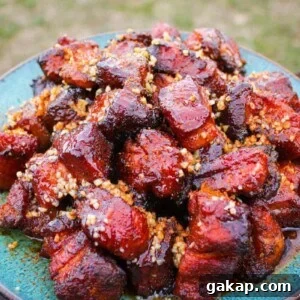 Honey Garlic Pork Belly Burnt Ends Recipe for Sticky, Crispy Bites 8 Honey Garlic Pork Belly Burnt Ends are served.