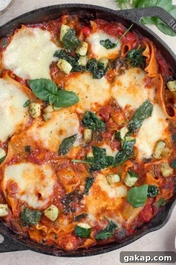 Overhead view of vegetarian lasagna in a cast iron skillet.