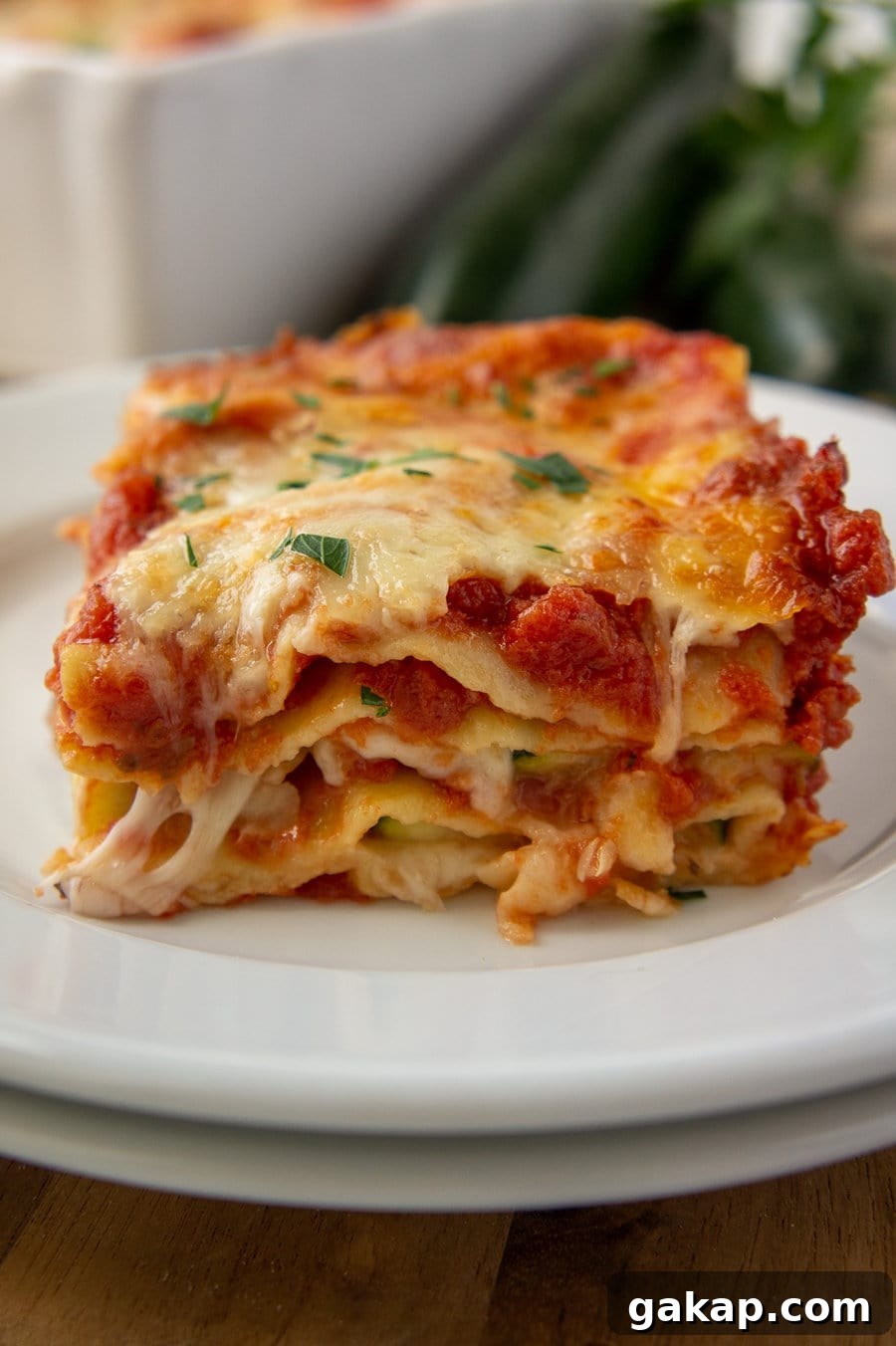 a view of the layers in a zucchini lasagna with noodles on a plate.