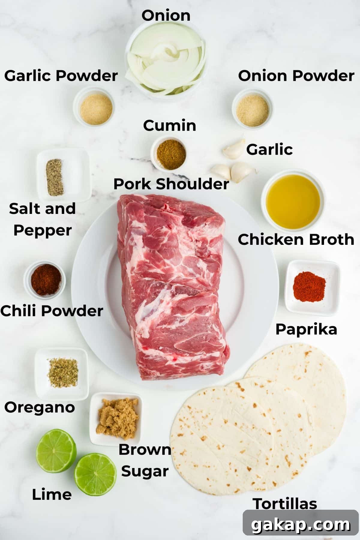 Ingredients to make pulled pork tacos in bowls on a table.