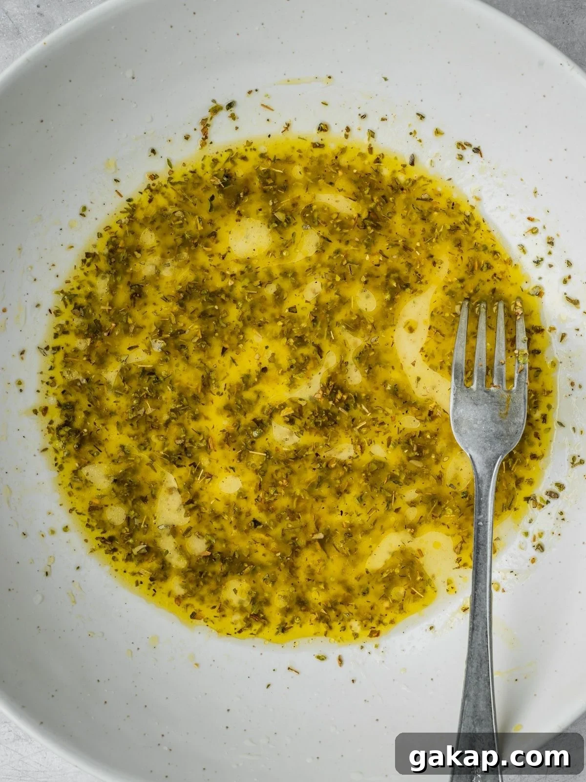 Salad dressing in a large bowl.