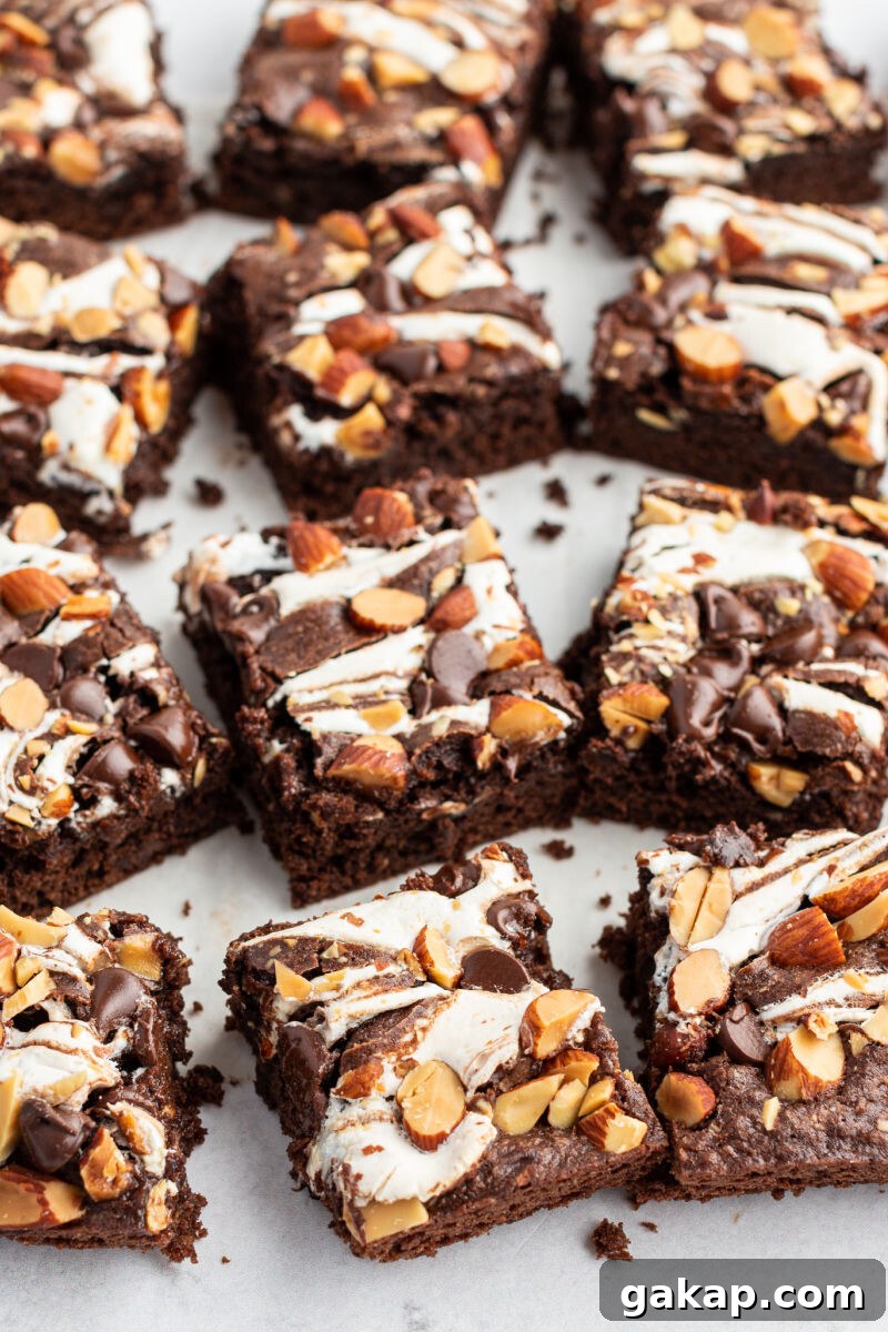 Decadent Rocky Road Brownies with Marshmallows and Nuts 2 close up of rocky road brownies on a cutting board