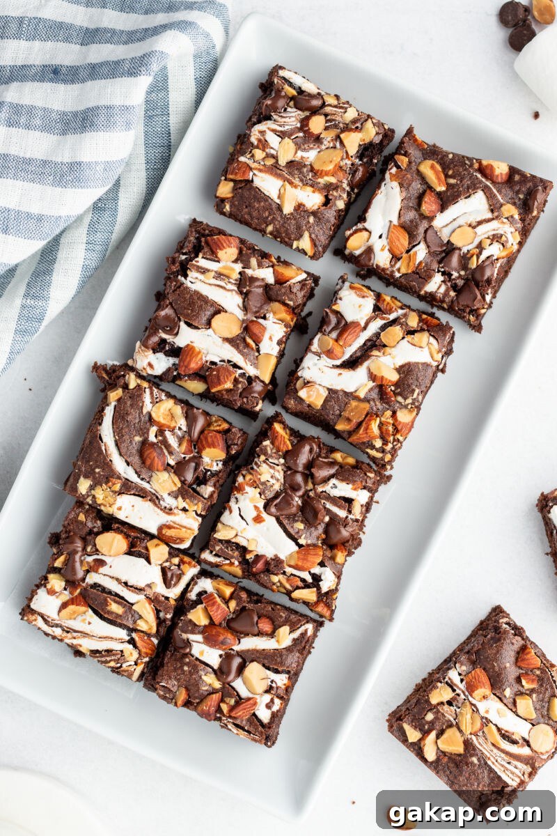 Decadent Rocky Road Brownies with Marshmallows and Nuts 3 rocky road brownies arranged on a serving platter