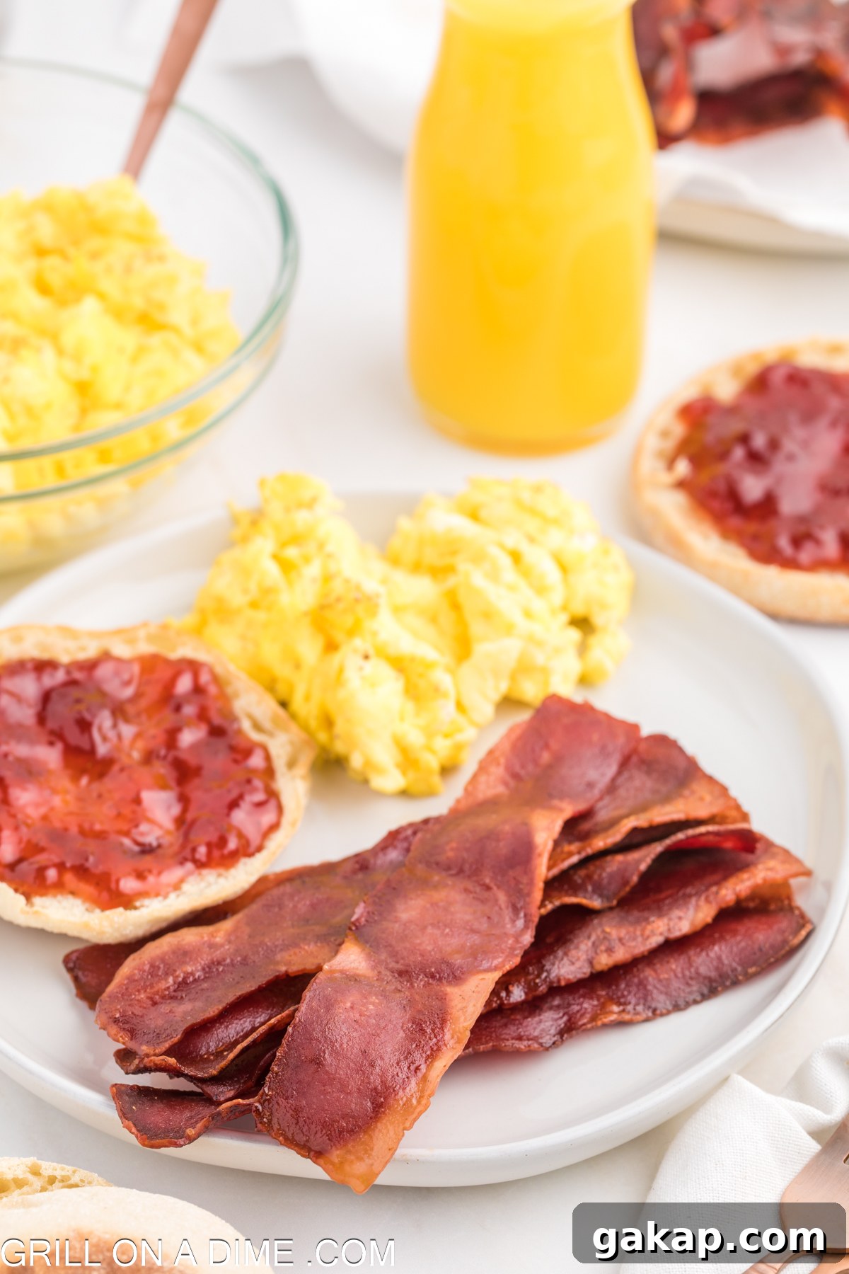 Turkey bacon on a plate with eggs and biscuit