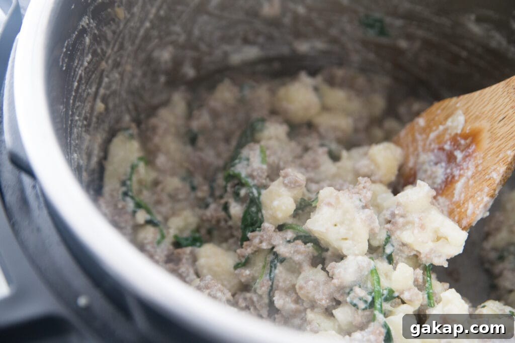 An Instant Pot with sausage and cauliflower casserole