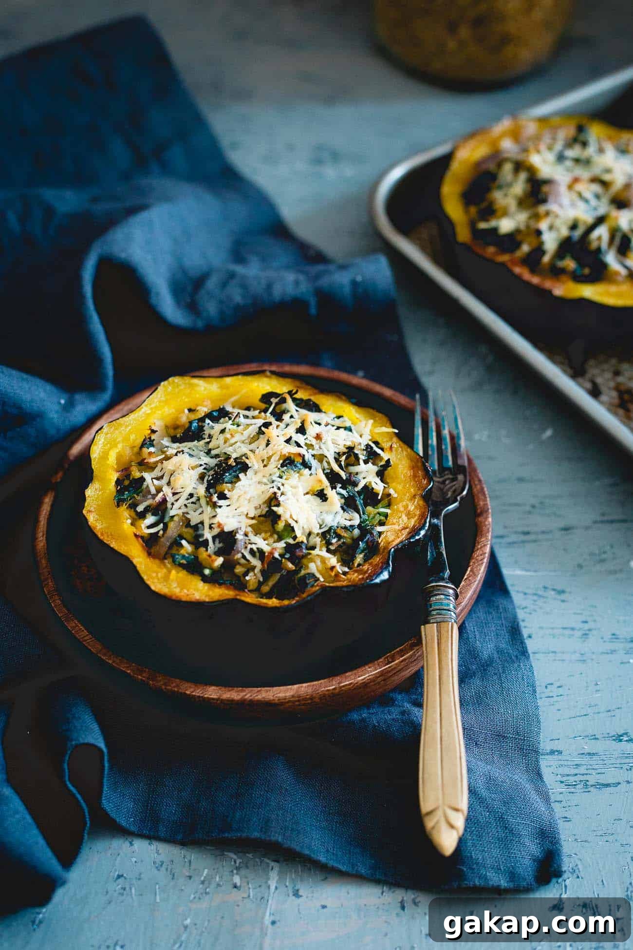 This twice baked acorn squash is stuffed with tuscan kale, hearty freekah and pecorino romano for a lovely fall side with a hidden protein boost. This twice baked acorn squash is stuffed with tuscan kale, hearty freekah and pecorino romano for a lovely fall side with a hidden protein boost.