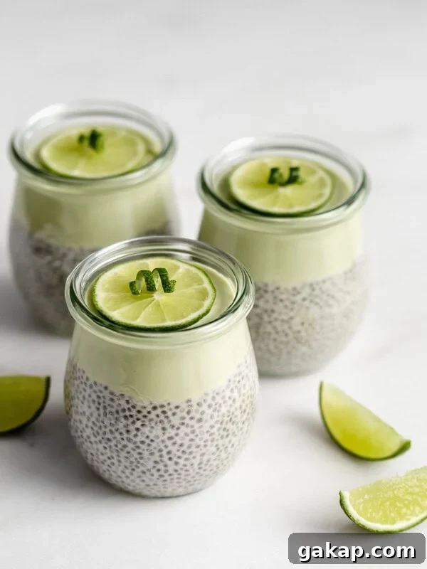 3 jars of key lime chia pudding with lime wedges on the side