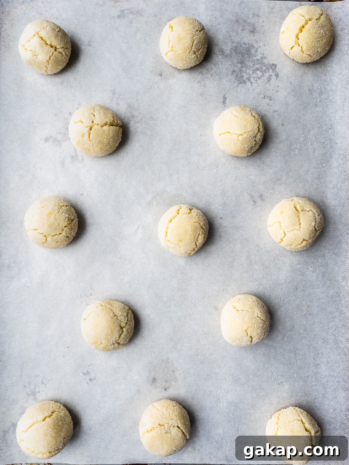 Baked amaretti cookies on sheet pan.