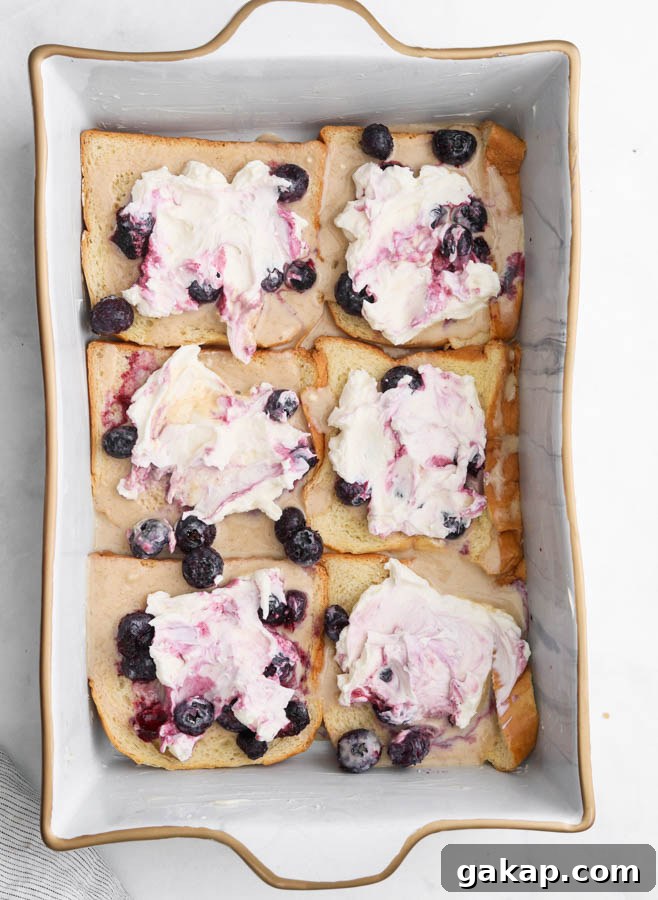 A picture of blueberry cream cheese french toast in a pan 