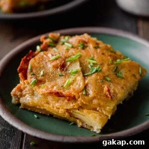 one square of scalloped potatoes on a small plate.