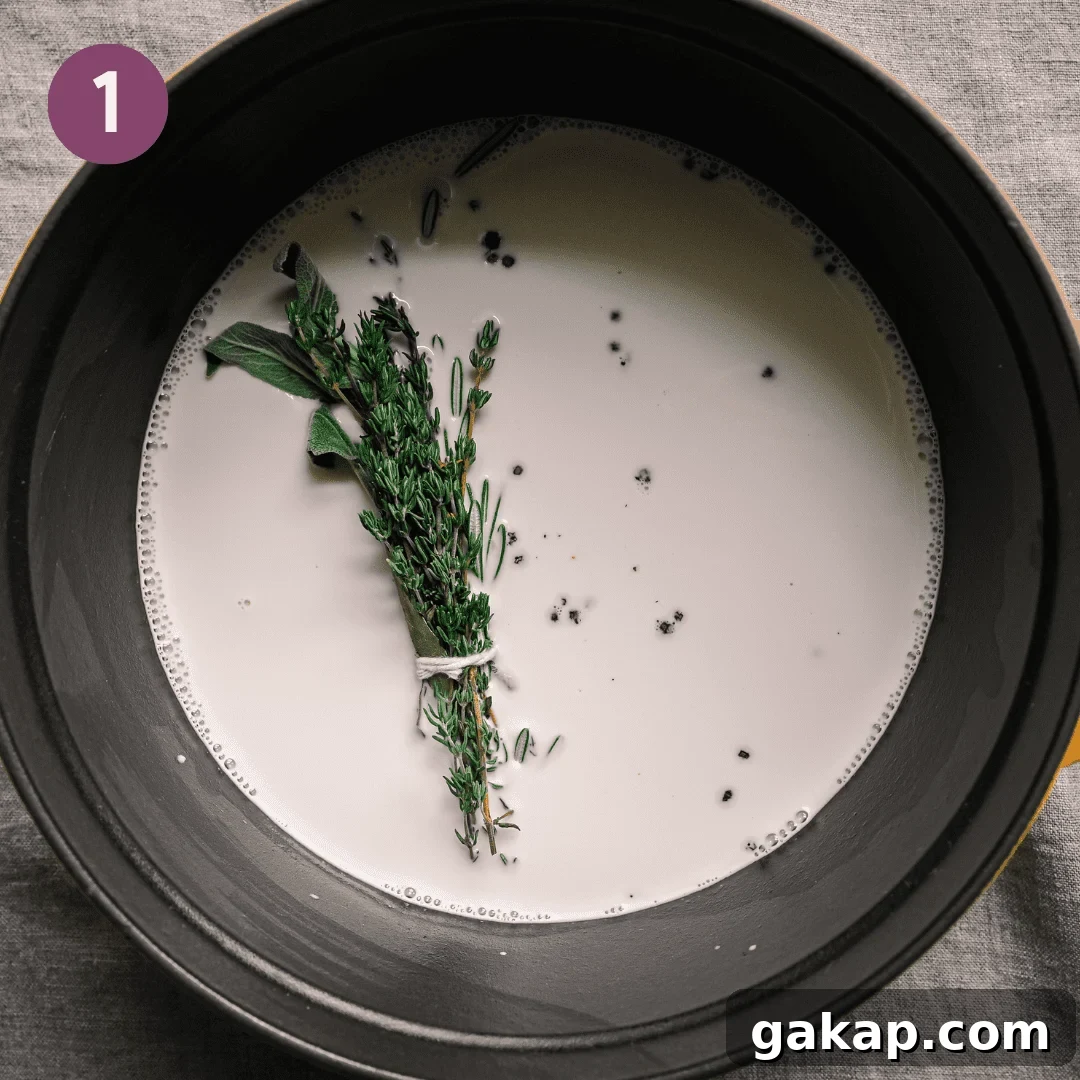 bouquet garni of herbs in a saucepan of milk