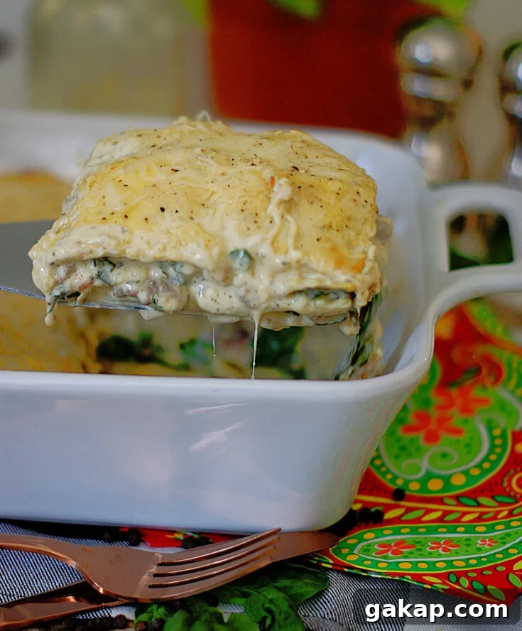 A serving of easy ravioli casserole being pulled from the pan.