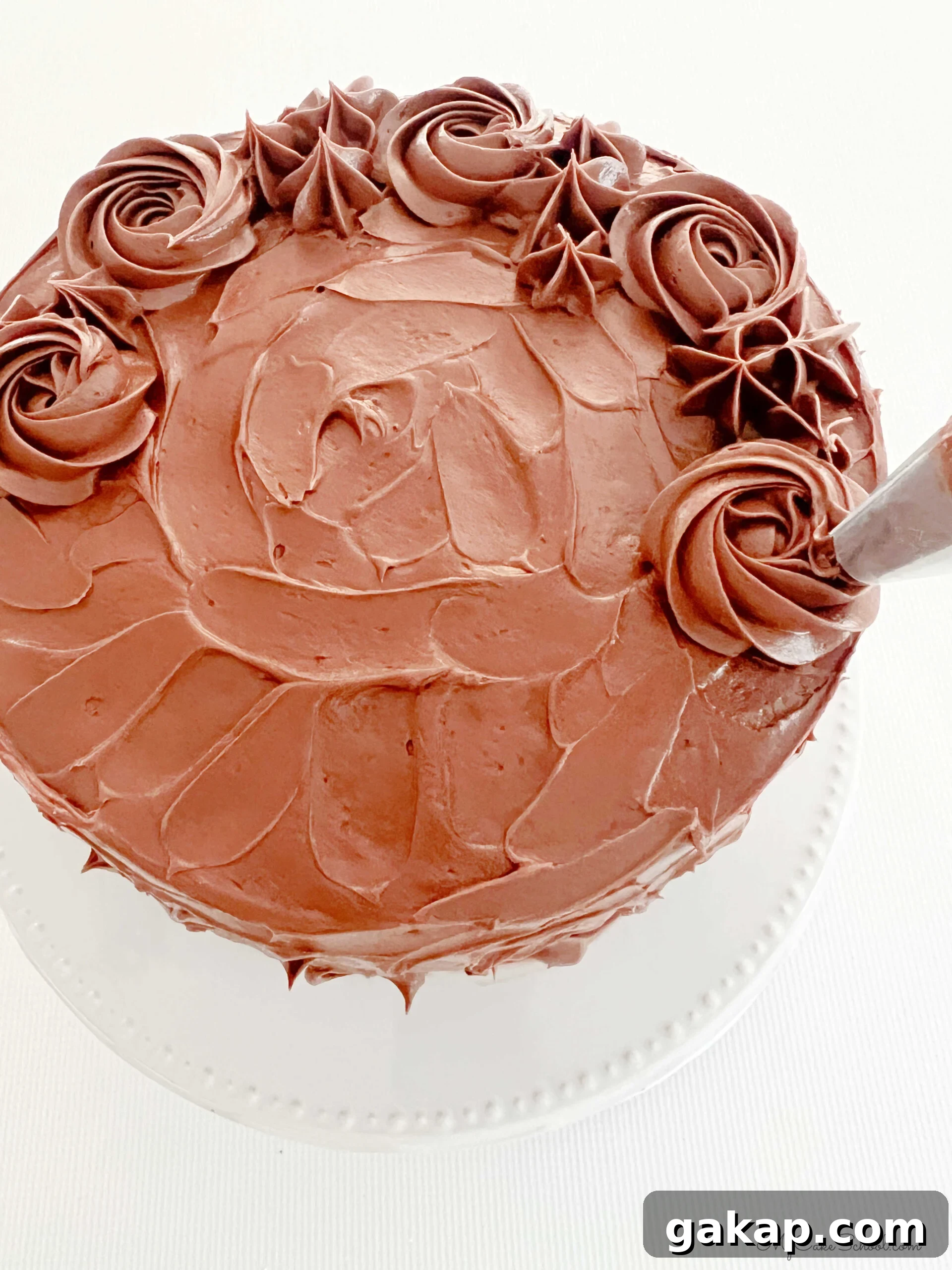Chocolate Mousse Cake Made from Cake Mix: Quick Decadent Dessert 9 Piping chocolate buttercream border of rosettes and stars on top of the cake, using a 1M piping tip.