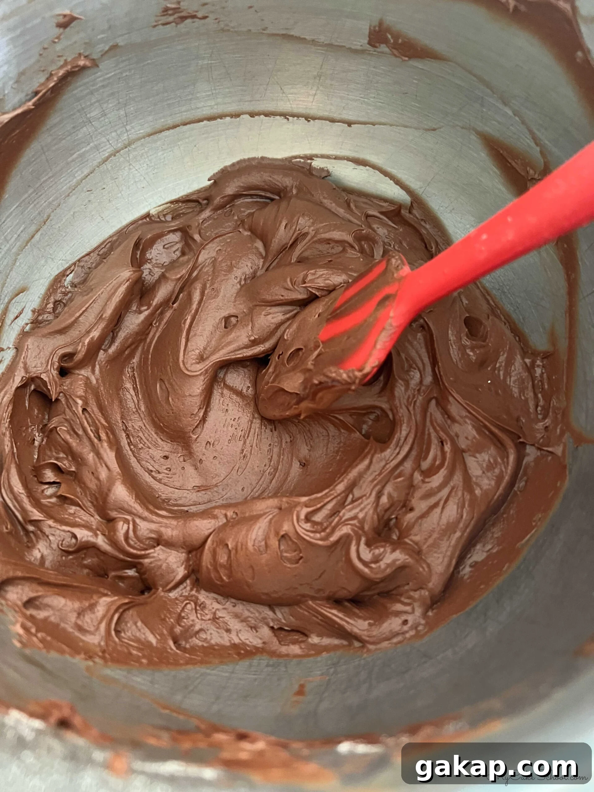 Chocolate Mousse Cake Made from Cake Mix: Quick Decadent Dessert 6 Chocolate Buttercream Frosting in mixing bowl.