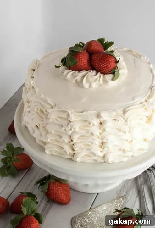 Decadent Strawberry Layer Cake Recipe with Fresh Berries 9 strawberry-cake-08-rev