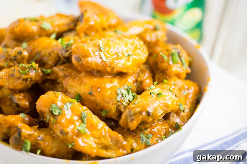 Crispy Baked Honey Lime Chicken Wings with Zesty Glaze 9 Family game night snacks including wings and 7UP.