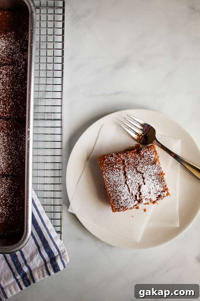 Light, Tender Gluten-Free Gingerbread Recipe for Perfect Spice 3 gluten free gingerbread slice on a white plate